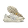 Scarpe da corsa basse per atletica, color crema
